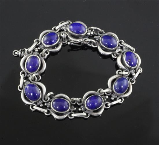 A Danish Georg Jensen sterling silver and cabochon lapis lazuli set bracelet, no. 10, 1915-1927 mark, approx. 17.8cm.